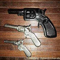 Spielzeugpistolen aus Blech